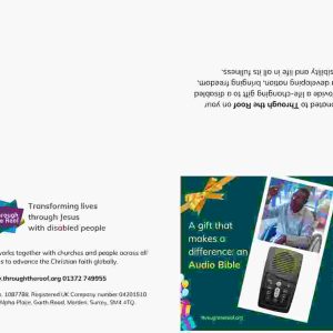 A print-at-home gift card on a dark green background, with text on the left that says: 'A gift that makes a difference: an Audio Bible’ To the right are 2 photos: a close-up photo of a solar-powered audio Bible (which looks like a small mobile phone); a smiling young Rwandan man holding an Audio Bible up in the air, as he sits in a wheelchair. Below the images is text saying: 'My gift to you supplies an Audio Bible so a disabled person hears the Word of life in their own language - like this young man in Rwanda. There are logos for Through the Roof www.throughtheroof.org and their project Wheels for the World. There is also a QR code linking to their International Missions page at https://throughtheroof.org/international-mission/