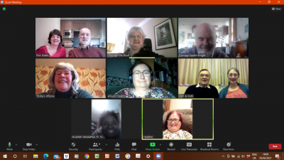 A screenshot from a Zoom event, with 8 people smiling and chatting on screen