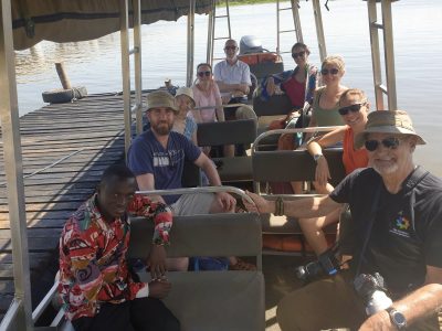 The team members sat wearing hats and sunglasses while they begin their boat trip