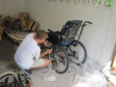 derek-working-on-wchair-in-haiti