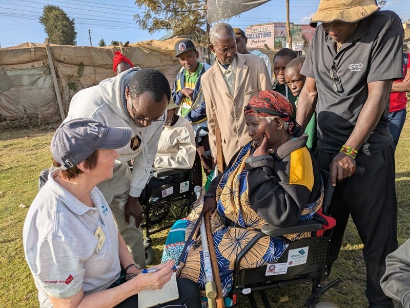 Esther, a local disabled lady in Kenya, is being interviewed by Jennifer, the UK correspondent, reporting on the Kenya 2026 Wheelchair distribution.