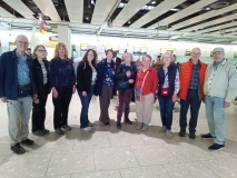 Ten UK volunteers at an airport en route to Kenya in 2026