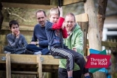 Two dads with their kids on the zip slide at the Dalesdown holiday centre