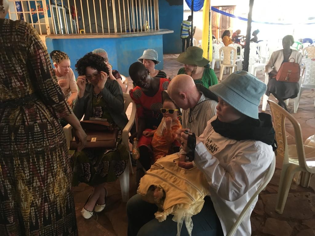 A group listening at the albinism workshop