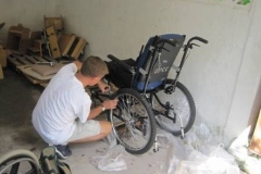 derek-working-on-wchair-in-haiti