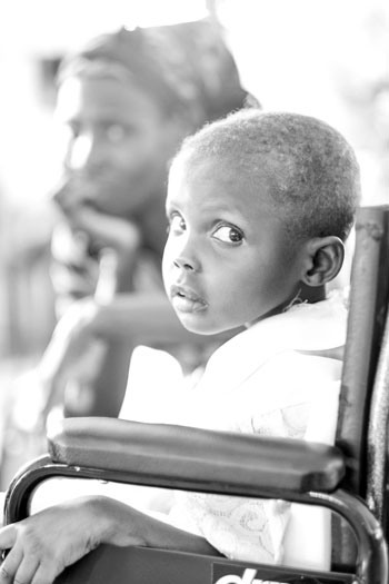 A young boy in his wheelchair