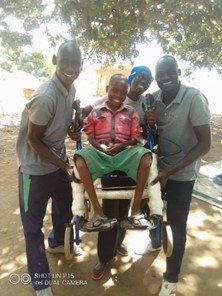Abudu and family in his new chair