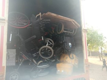 A shipping container full of wheelchairs