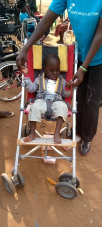Another child on the trip is fitted with a buggy