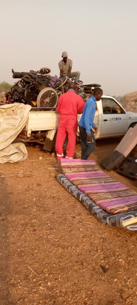 The HHA team arriving in the area and unloading wheelchairs from the back of a truck