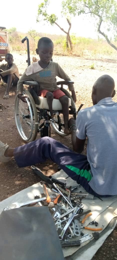 Cosmas in her new wheelchair