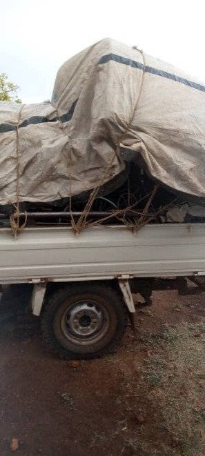 A pick up truck, loaded with wheelchairs