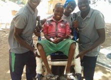 Abudu and family in his new chair