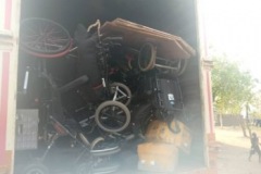 A shipping container full of wheelchairs